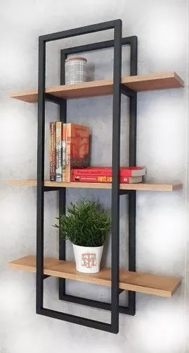 Estante de pared moderno con libros, planta en maceta blanca y objeto decorativo en estructura negra y repisas de madera.